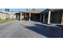 Covered front patio with rocking chairs and decorative flooring at 5162 Woodruff Pl, Las Vegas, NV 89120