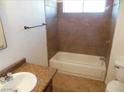 Clean bathroom with tile shower/tub combo and granite vanity at 5175 Orinda Ave, Las Vegas, NV 89120