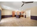 Kitchen with an island, granite countertops, and wooden cabinets at 5338 Lignum Ave, Pahrump, NV 89061