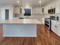 Spacious kitchen featuring a large island and stainless steel appliances at 5932 Quintillion Ave, Las Vegas, NV 89122