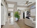 Bright and spacious living room with vinyl flooring and views into other rooms at 7291 Purple Shadow Ave, Las Vegas, NV 89113