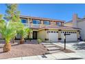 Two-story house with a three-car garage and a landscaped front yard, featuring a pool at 7978 Coronado Coast St, Las Vegas, NV 89139