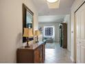 Bright entryway with a console table, mirror, and view into living room at 8255 Las Vegas Blvd # 619, Las Vegas, NV 89123