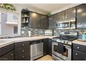 Modern kitchen with stainless steel appliances and stylish backsplash at 9016 Sundial Dr, Las Vegas, NV 89134