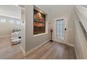 Bright and spacious entryway with modern wood-look floors at 9048 Rich Amethyst Ct, Las Vegas, NV 89149