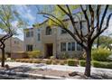 Two-story house with a landscaped yard and attractive curb appeal at 9048 Rich Amethyst Ct, Las Vegas, NV 89149