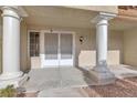 Front entrance with double doors and columns at 9308 Cactus Wood Dr, Las Vegas, NV 89134