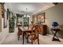 Elegant dining room with hardwood table and chairs at 3042 Hammerwood Dr, Las Vegas, NV 89135