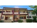 Front view of a two-story building with balconies and stairs at 350 E Desert Inn Rd # 202, Las Vegas, NV 89109
