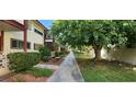 Landscaped walkway between apartment buildings with lush greenery at 350 E Desert Inn Rd # 202, Las Vegas, NV 89109