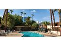 Inviting community swimming pool with surrounding lounge chairs at 350 E Desert Inn Rd # 202, Las Vegas, NV 89109