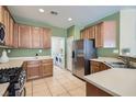 Kitchen with stainless steel appliances and wood cabinets at 3929 Prescott Pines St # 103, Las Vegas, NV 89108