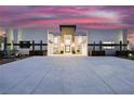 Modern home with two-car garage and desert landscaping at 7815 W La Madre Way, Las Vegas, NV 89149