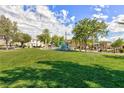 Community playground with grassy area at 8949 Appellation Ave, Las Vegas, NV 89148