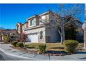 Two-story house with attached garage and manicured lawn at 10332 Splendor Ridge Ave, Las Vegas, NV 89135