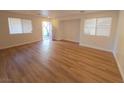 Bright living room with hardwood floors and an open floor plan at 11998 Camden Brook St, Las Vegas, NV 89183