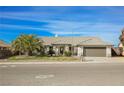 Single-story home with attached garage and desert landscaping at 1960 S Vineyard Dr, Pahrump, NV 89048