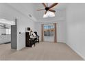 Living room with piano, high ceilings and view to backyard at 1968 Revere Ct, Henderson, NV 89014