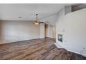 Spacious living room with wood floors and ceiling fan at 2214 Sexton Ave, North Las Vegas, NV 89031