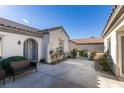 Inviting front patio with seating area and well-manicured landscaping at 2429 Anderson Park Dr, Henderson, NV 89044