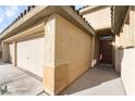 Front entry and three-car garage at 3008 Blush Noisette Ave, North Las Vegas, NV 89081