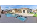 Inviting backyard oasis featuring a pool and spa at 315 Rhiannon Ct, Las Vegas, NV 89183