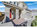 House entrance with a red door and paved walkway at 3494 Brezine Ave, Henderson, NV 89044