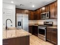 Modern kitchen with stainless steel appliances and granite countertops at 4543 Pencester St, Las Vegas, NV 89115