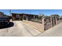 View of charming single-story home featuring an inviting front yard and driveway at 4559 S Nellis Blvd, Las Vegas, NV 89121