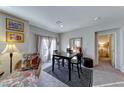 Cozy dining area with a table and chairs, adjacent to a bedroom at 4710 Blaise Ave # 101, North Las Vegas, NV 89084