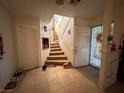 Tiled entryway with staircase and front door at 508 Sarajane Ln, Las Vegas, NV 89107