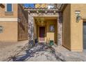 Front entrance with stone accents and a covered porch at 634 Wounded Star Ave, Las Vegas, NV 89178