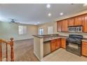 Kitchen with stainless steel appliances and an island at 9936 Fountain Walk Ave, Las Vegas, NV 89149