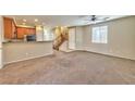 Living room with carpet flooring and a ceiling fan at 9936 Fountain Walk Ave, Las Vegas, NV 89149