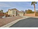 Single-story house with a two-car garage and well-maintained yard at , Las Vegas, NV 89148