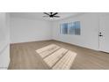 Bright and airy living room with light wood flooring at 2028 Hassell Ave, North Las Vegas, NV 89032