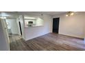 Bright living room with kitchen and hardwood floors at 2300 E Silverado Ranch Blvd # 1151, Las Vegas, NV 89183
