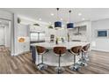Modern kitchen with large island, stainless steel appliances, and white cabinets at 286 Chartan Ave, Las Vegas, NV 89183
