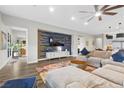 Spacious living room with large sectional sofa, accent wall, and hardwood floors at 286 Chartan Ave, Las Vegas, NV 89183