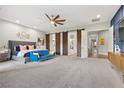 Large main bedroom with sliding barn doors to the bathroom and large windows at 286 Chartan Ave, Las Vegas, NV 89183
