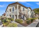 Two-story building with multiple units, featuring a walkway and landscaping at 3540 Cactus Shadow St # 201, Las Vegas, NV 89129