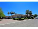 House exterior showcasing a large driveway and mature palm trees at 4638 Evan Ridge Ct, Las Vegas, NV 89129