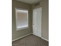Cozy bedroom featuring neutral walls and carpet and a window for natural lighting at 509 5Th St, Boulder City, NV 89005