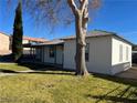 House with mature tree and grassy yard at 509 5Th St, Boulder City, NV 89005
