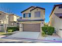 Charming two-story home with a well-manicured lawn, inviting curb appeal, and an attached two-car garage at 5648 Ancient Agora St, North Las Vegas, NV 89031