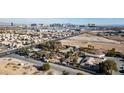 Aerial view showing a large property with a house and a sizable lot, near the city skyline at 5785 W Russell Rd, Las Vegas, NV 89118
