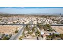Aerial view showcasing a house on a large lot with mature trees and desert landscaping at 5785 W Russell Rd, Las Vegas, NV 89118