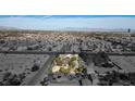 Aerial view of a home situated on a large lot, offering expansive views of the surrounding area at 5785 W Russell Rd, Las Vegas, NV 89118