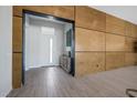 Modern entryway with wood wall accents and tile flooring at 8838 Sorrel Hills Ct, Las Vegas, NV 89113