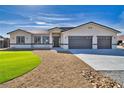 Attractive single-story home with a well-manicured lawn, desert landscaping, and an inviting entrance at 1131 Blackhorn St, Pahrump, NV 89048